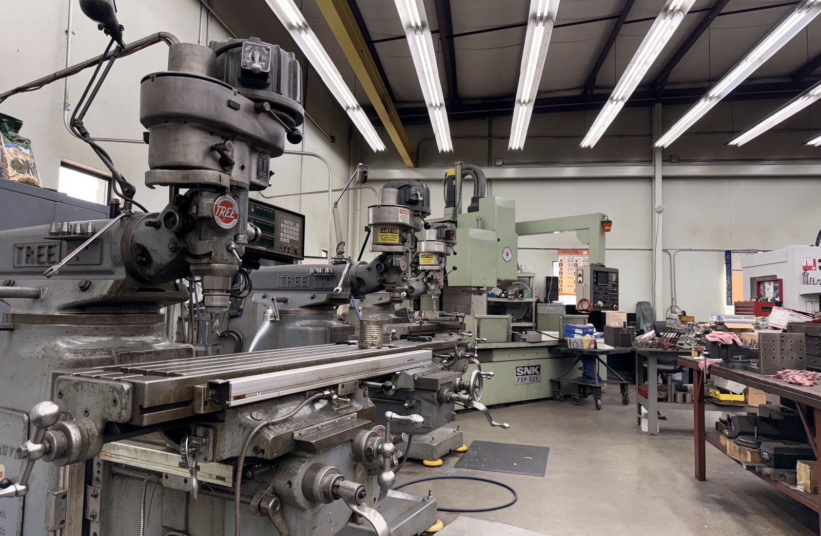 A manual vertical milling machine with a digital readout in the tool room